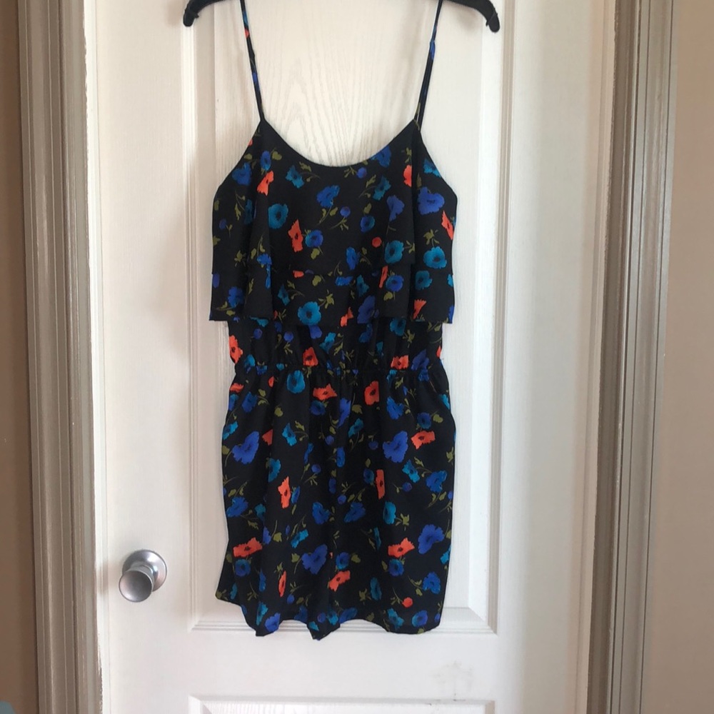 Super cute romper with pockets.